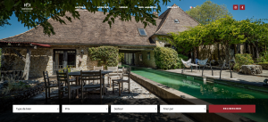 Page d'accueil de ICI Dordogne, agence immobilière, on peut voir une belle demeure vue de l'extérieur